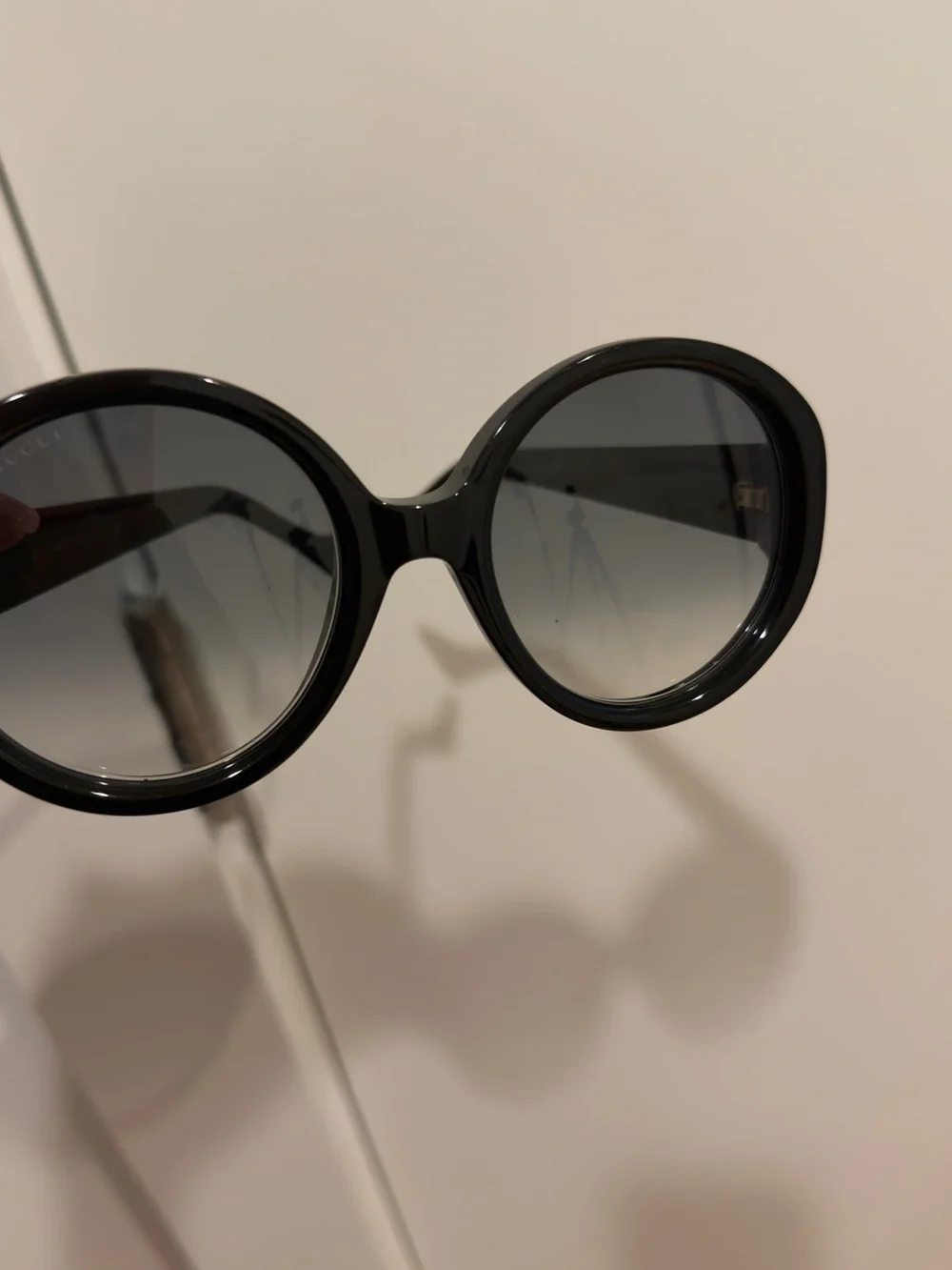 Gucci Black Round Sunglasses with Gold Logo Accent
